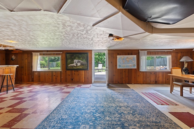 2250 Saines Manor Dr, Jackson, MI 49201 - entrance foyer with tile patterned floors and wood walls