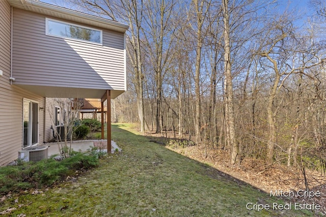 view of yard featuring a patio and cooling unit