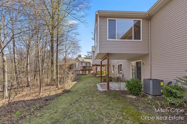 view of yard featuring central AC unit and a patio area
