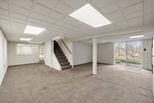 below grade area with stairway and carpet floors