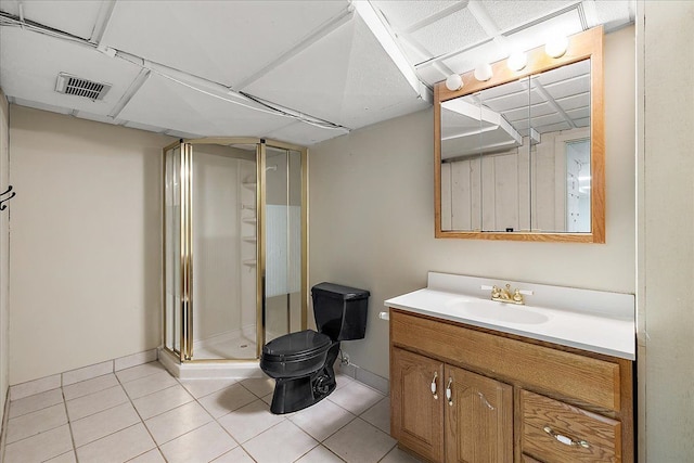 full bath featuring a stall shower, tile patterned flooring, visible vents, and vanity
