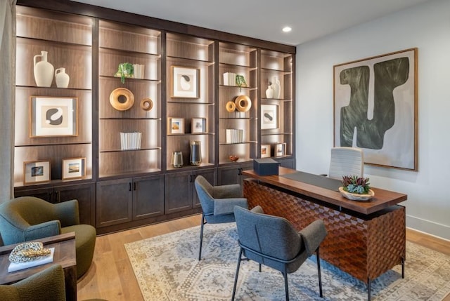 home office featuring light wood-type flooring and recessed lighting
