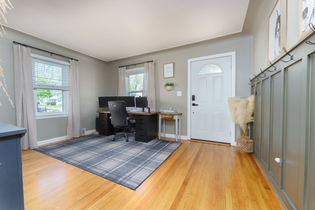 home office featuring baseboards and light wood-style floors