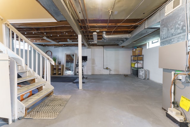 basement featuring visible vents and stairway