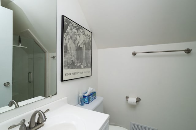 full bathroom with a shower stall, visible vents, toilet, vaulted ceiling, and vanity