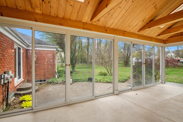 unfurnished sunroom with wooden ceiling, vaulted ceiling with beams, and concrete flooring