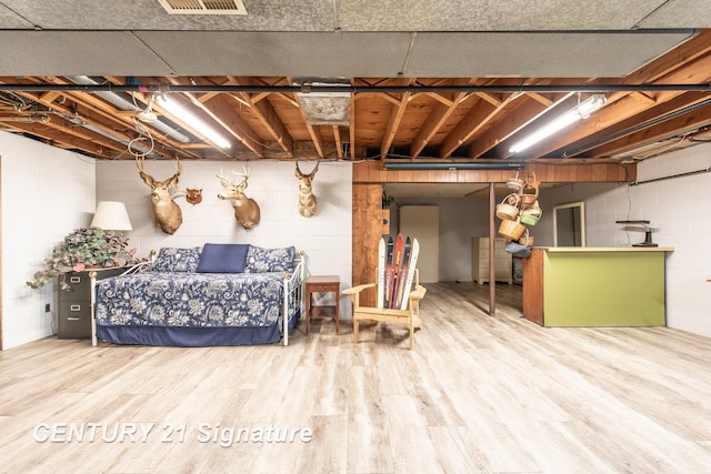 33 Ferro St, Sanford, MI 48657 - unfinished basement featuring visible vents and wood finished floors