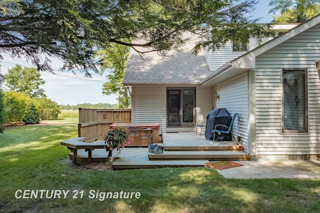 33 Ferro St, Sanford, MI 48657 - back of property with a deck, a hot tub, a yard, and roof with shingles