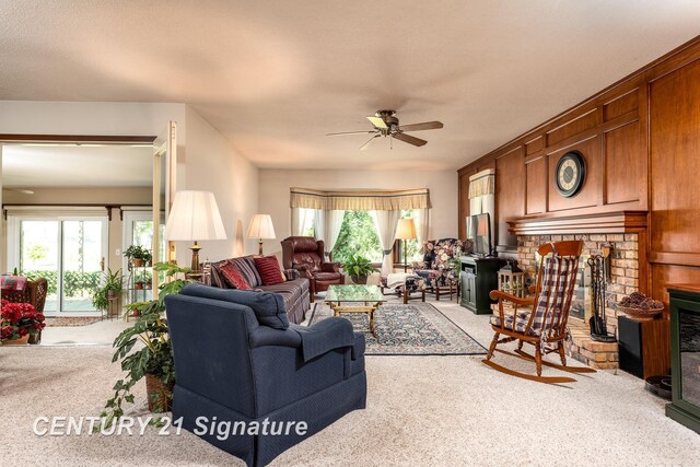 33 Ferro St, Sanford, MI 48657 - living room with a healthy amount of sunlight, carpet, and a brick fireplace