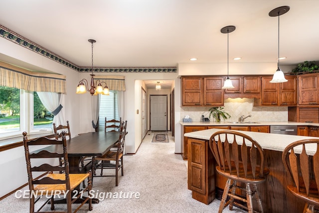 33 Ferro St, Sanford, MI 48657 - kitchen with dishwasher, brown cabinets, light countertops, and a sink