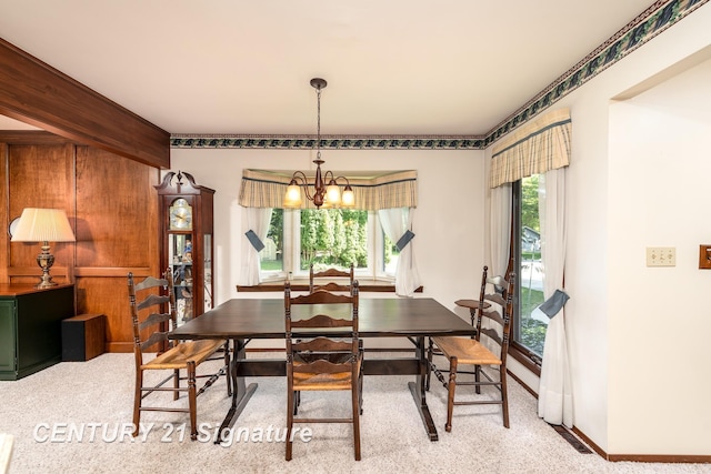 33 Ferro St, Sanford, MI 48657 - dining space with a chandelier, baseboards, and visible vents