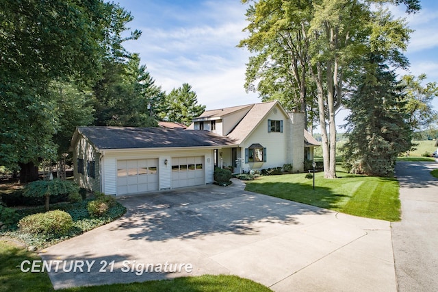 33 Ferro St, Sanford, MI 48657 - view of front of house featuring a front yard, concrete driveway, and an attached garage