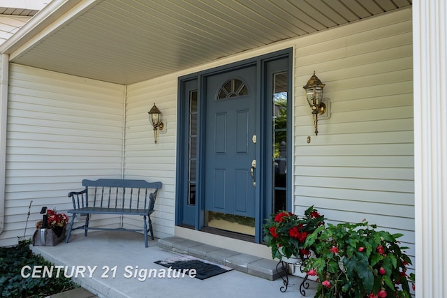 33 Ferro St, Sanford, MI 48657 - entrance to property featuring covered porch