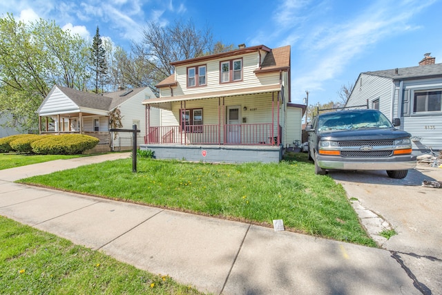8127 Continental Ave, Warren, MI 48089 - view of front of property featuring covered porch and a front yard
