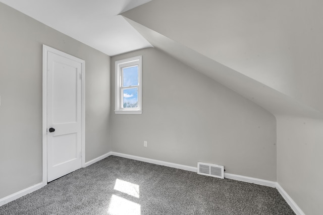 8127 Continental Ave, Warren, MI 48089 - bonus room featuring baseboards, visible vents, carpet floors, and vaulted ceiling