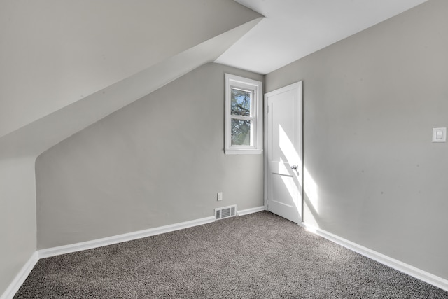 8127 Continental Ave, Warren, MI 48089 - additional living space featuring baseboards, visible vents, carpet floors, and lofted ceiling