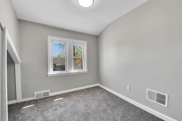 8127 Continental Ave, Warren, MI 48089 - unfurnished room featuring lofted ceiling, carpet, visible vents, and baseboards