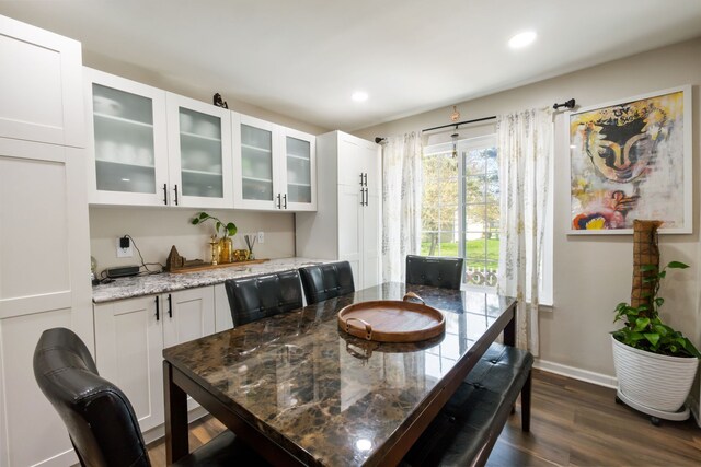 dining room featuring recessed lighting, baseboards, and dark wood-style floors
