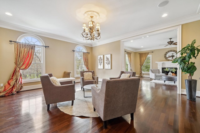 810 Highwood Dr, Bloomfield Hills, MI 48304 - living room with recessed lighting, a healthy amount of sunlight, a lit fireplace, and dark wood-type flooring