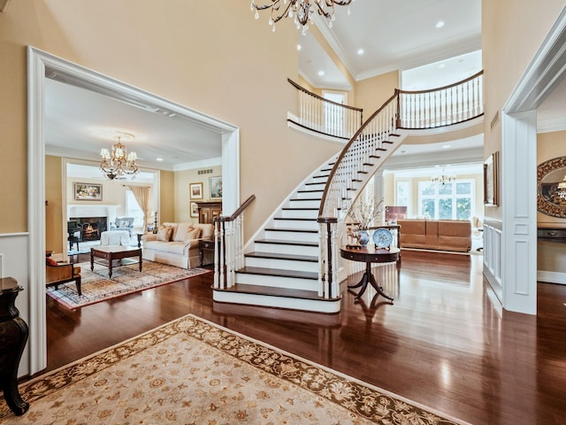 810 Highwood Dr, Bloomfield Hills, MI 48304 - entryway with stairway, a notable chandelier, crown molding, and plenty of natural light