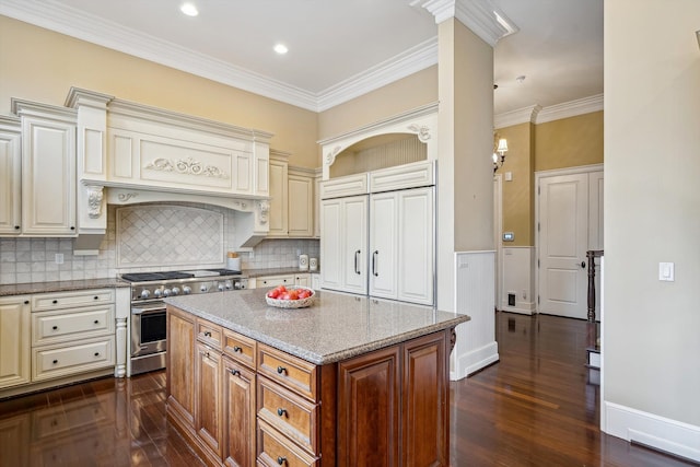 810 Highwood Dr, Bloomfield Hills, MI 48304 - kitchen featuring dark wood-style floors, high end stainless steel range, cream cabinets, and light stone counters