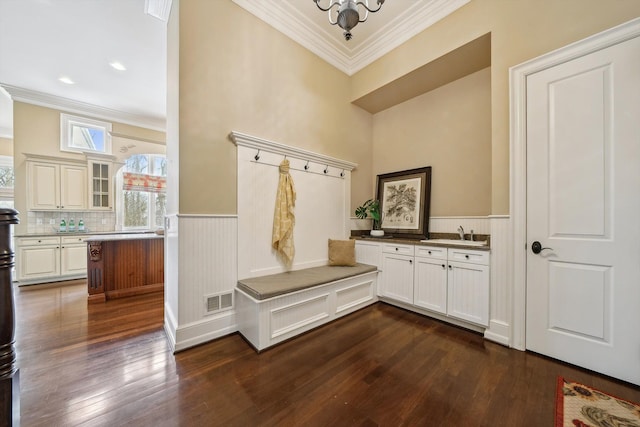 810 Highwood Dr, Bloomfield Hills, MI 48304 - mudroom featuring dark wood-type flooring, visible vents, a wainscoted wall, and crown molding