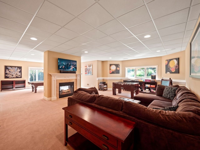 810 Highwood Dr, Bloomfield Hills, MI 48304 - living area with a paneled ceiling, carpet flooring, a wealth of natural light, and a glass covered fireplace