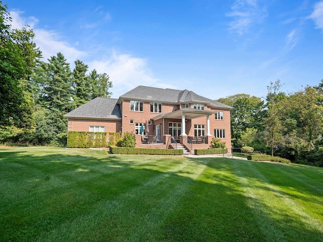 810 Highwood Dr, Bloomfield Hills, MI 48304 - rear view of house featuring a lawn, a patio, and brick siding