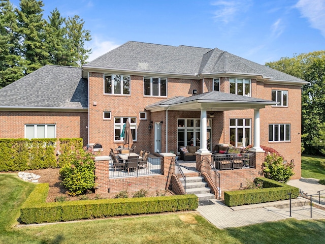 810 Highwood Dr, Bloomfield Hills, MI 48304 - back of property featuring a patio, an outdoor living space, roof with shingles, and brick siding