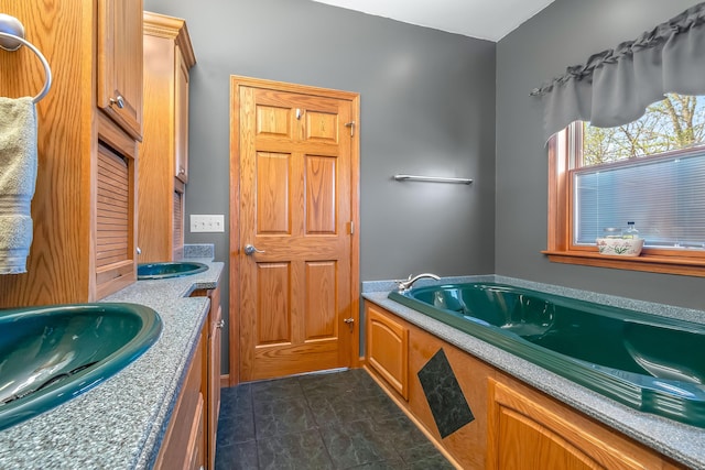 3553 Alpine Ct, Hillsdale, MI 49242 - bathroom with double vanity, a bath, tile patterned flooring, and a sink