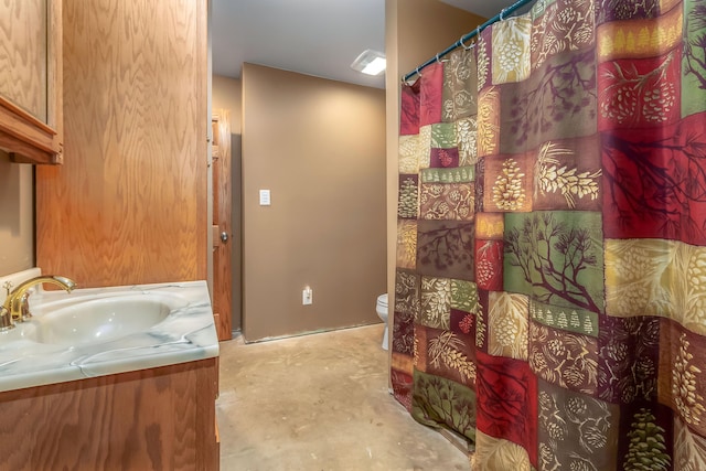 3553 Alpine Ct, Hillsdale, MI 49242 - bathroom with a shower with shower curtain, toilet, concrete floors, and vanity