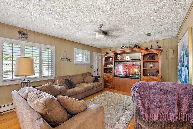 37337 Lakeshore Dr, Harrison Township, MI 48045 - living area with a baseboard radiator, wood finished floors, visible vents, and a textured ceiling