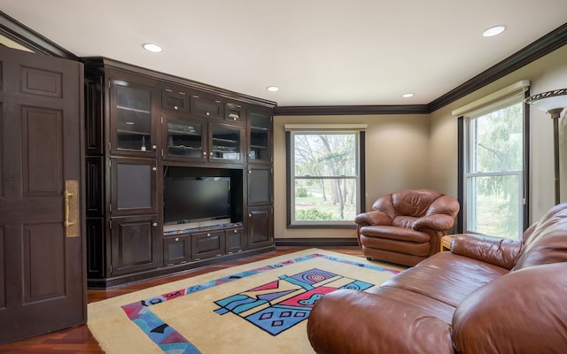 living room with crown molding and recessed lighting