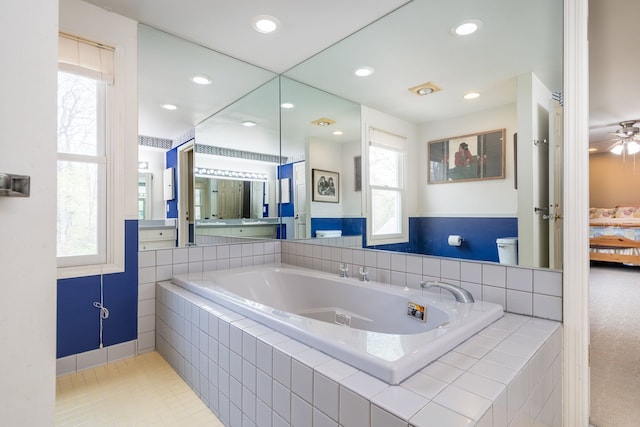 full bathroom with ceiling fan, a bath, toilet, ensuite bathroom, and recessed lighting