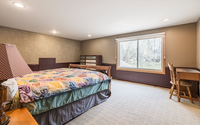 bedroom featuring recessed lighting and wainscoting