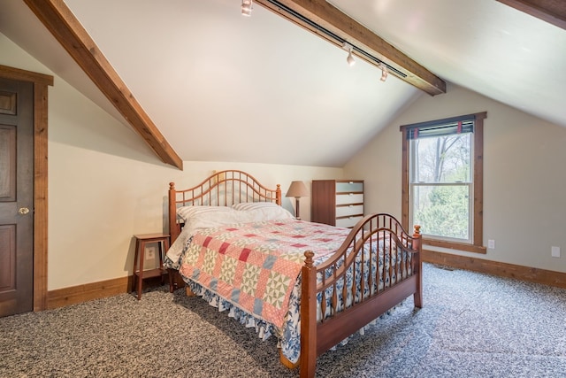 bedroom with carpet floors, lofted ceiling with beams, baseboards, and track lighting