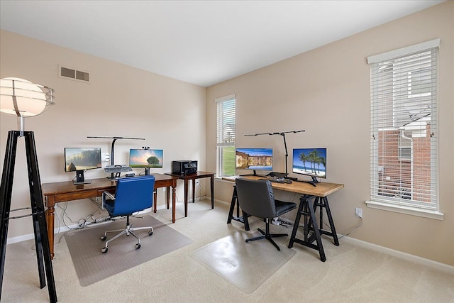 office area featuring carpet flooring, baseboards, and visible vents