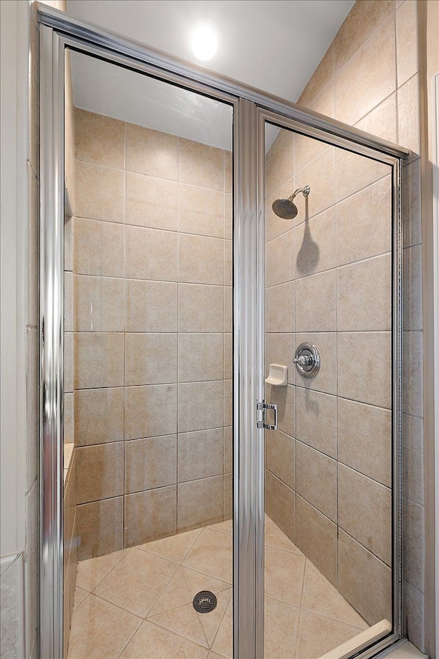 full bathroom with a shower stall