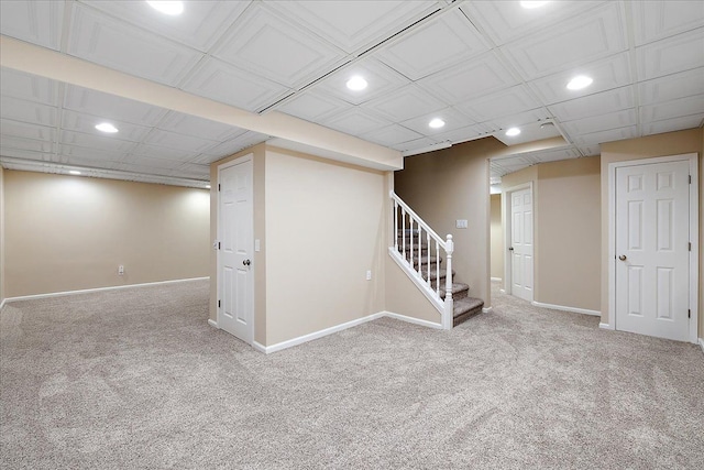 finished below grade area featuring carpet flooring, recessed lighting, and baseboards