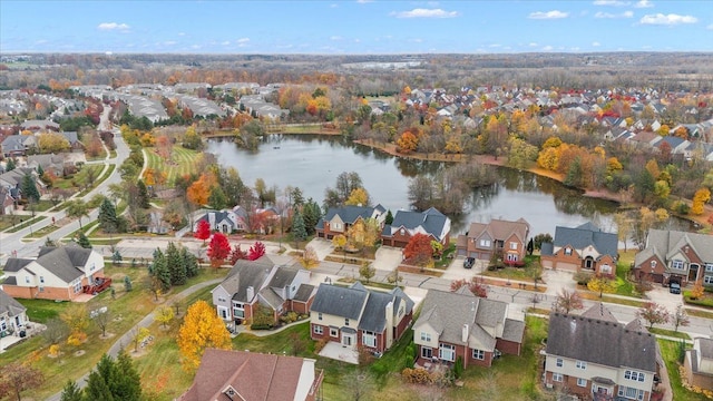 birds eye view of property featuring a water view and a residential view