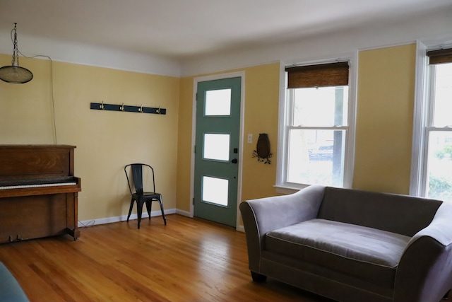 interior space with wood finished floors and baseboards