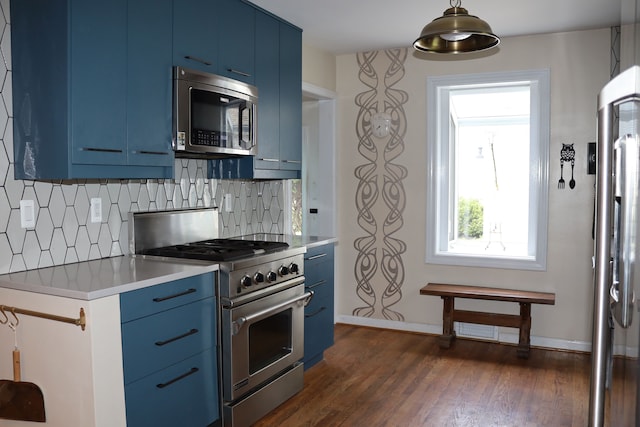 kitchen with light countertops, stainless steel appliances, and blue cabinets