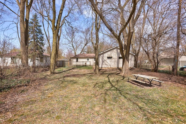 view of yard with a garage and fence