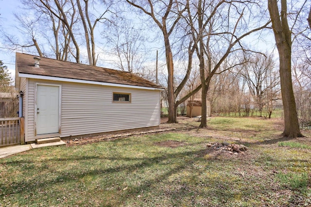 view of yard featuring fence and an outdoor structure