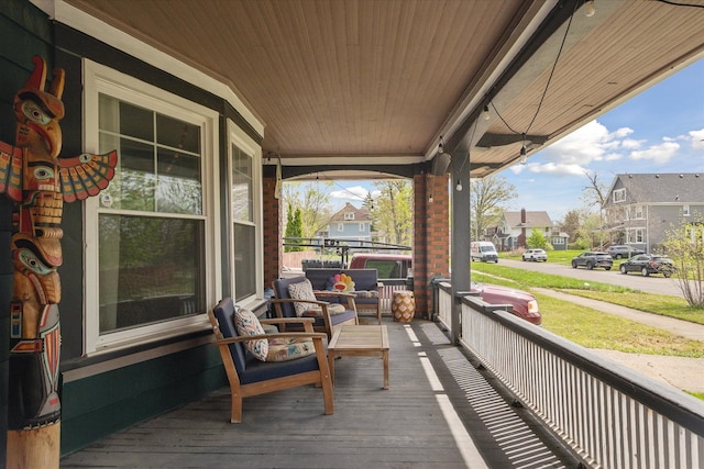 deck featuring a residential view, an outdoor hangout area, and a porch