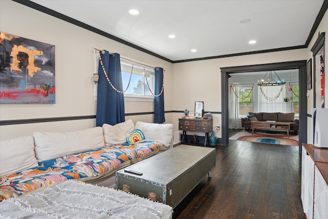 living area with an inviting chandelier, ornamental molding, recessed lighting, and hardwood / wood-style flooring