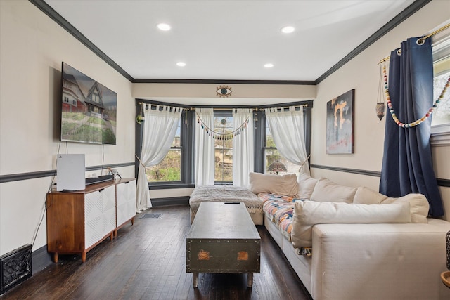 living area with crown molding, recessed lighting, hardwood / wood-style flooring, and visible vents