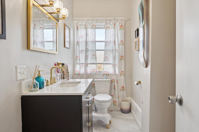 full bathroom with vanity, marble finish floor, a notable chandelier, and toilet