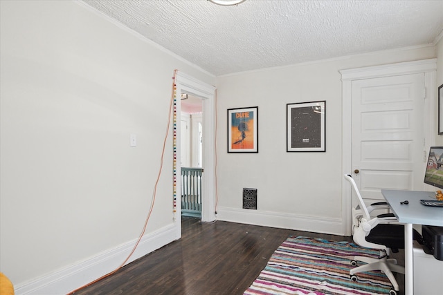 office area featuring a textured ceiling, baseboards, ornamental molding, and dark wood-type flooring