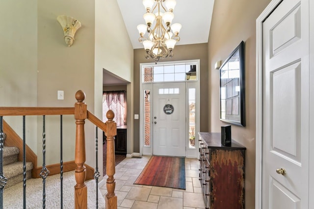 1355 Ridge View Ct, Grand Blanc, MI 48439 - foyer with baseboards, high vaulted ceiling, stairway, stone finish flooring, and a notable chandelier